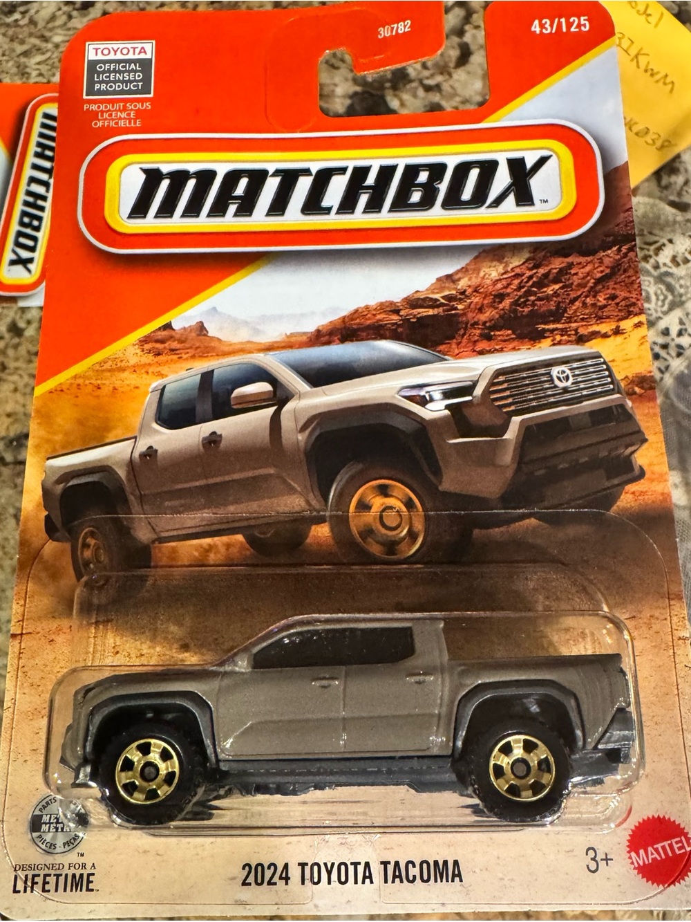 Matchbox 2024 Toyota Tacoma Toy Truck - Gray with Gold Wheels